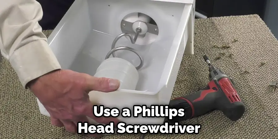 Use a Phillips Head Screwdriver