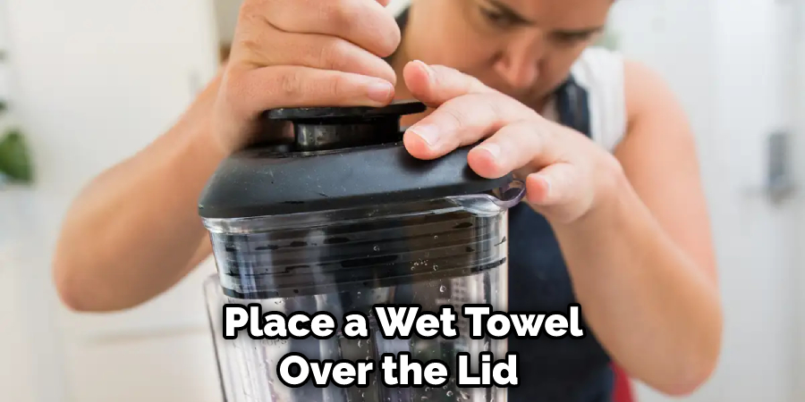 Place a Wet Towel Over the Lid 