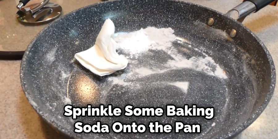  Sprinkle Some Baking Soda Onto the Pan