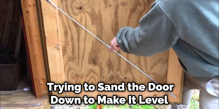  Trying to Sand the Door Down to Make It Level
