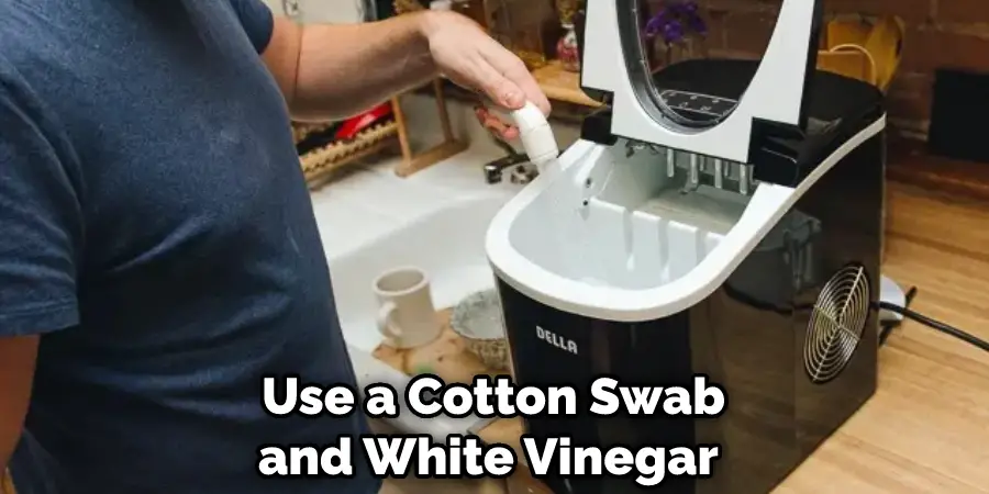 Use a Cotton Swab and White Vinegar 