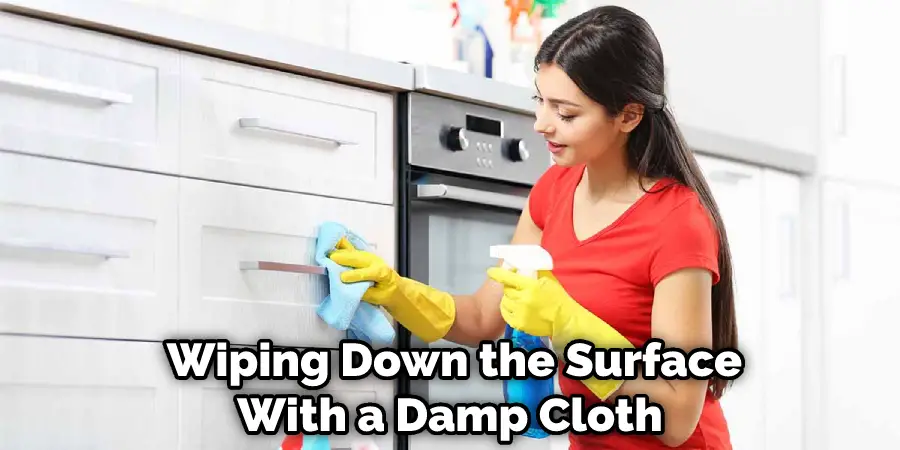  Wiping Down the Surface With a Damp Cloth