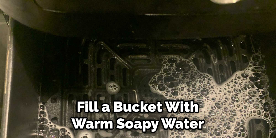 Fill a Bucket With Warm Soapy Water