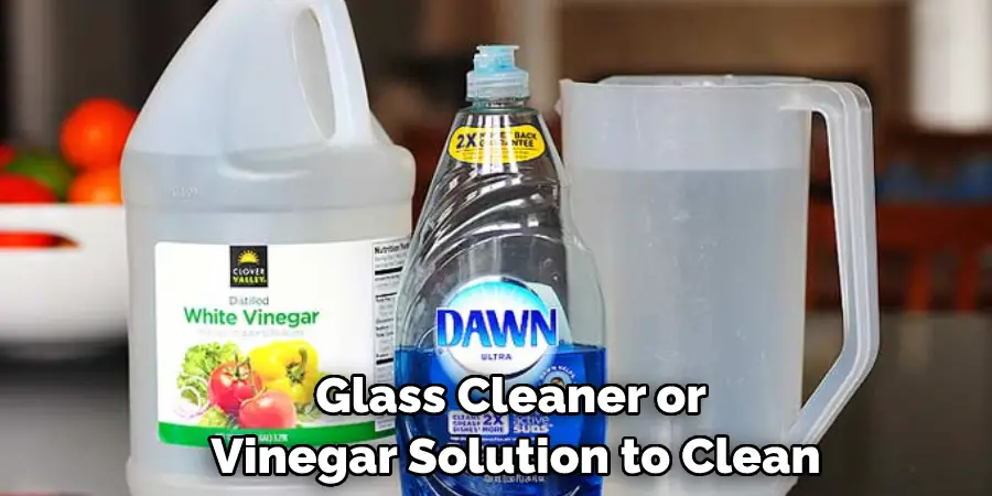 Glass Cleaner or Vinegar Solution to Clean
