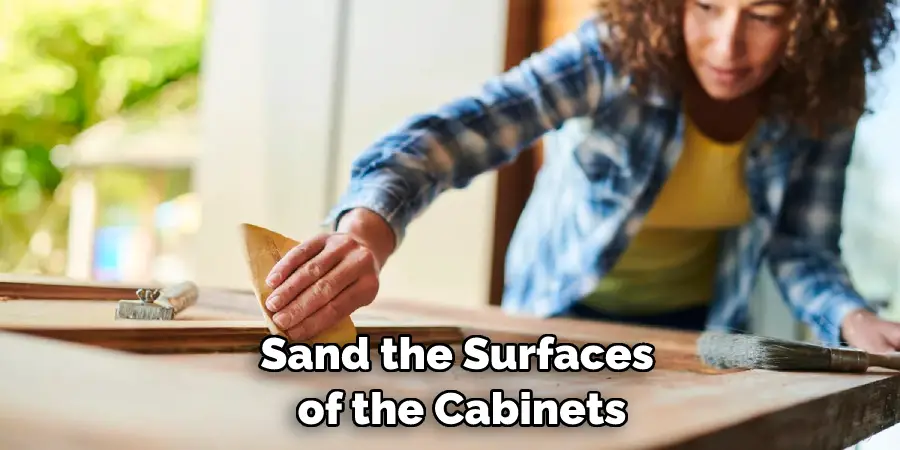 Sand the Surfaces of the Cabinets