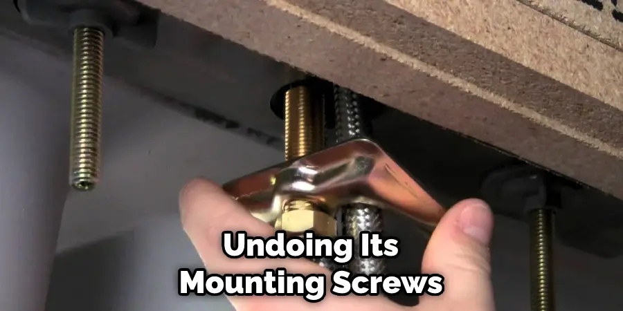 Undoing Its Mounting Screws