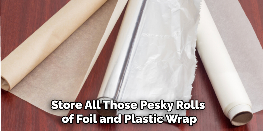 Store All Those Pesky Rolls of Foil and Plastic Wrap