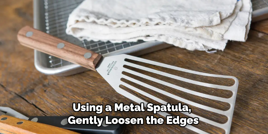 Using a Metal Spatula, Gently Loosen the Edges