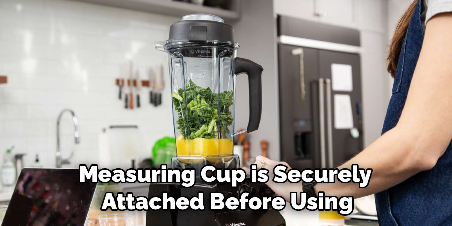 Measuring Cup is Securely Attached Before Using