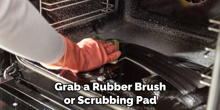 Grab a Rubber Brush or Scrubbing Pad