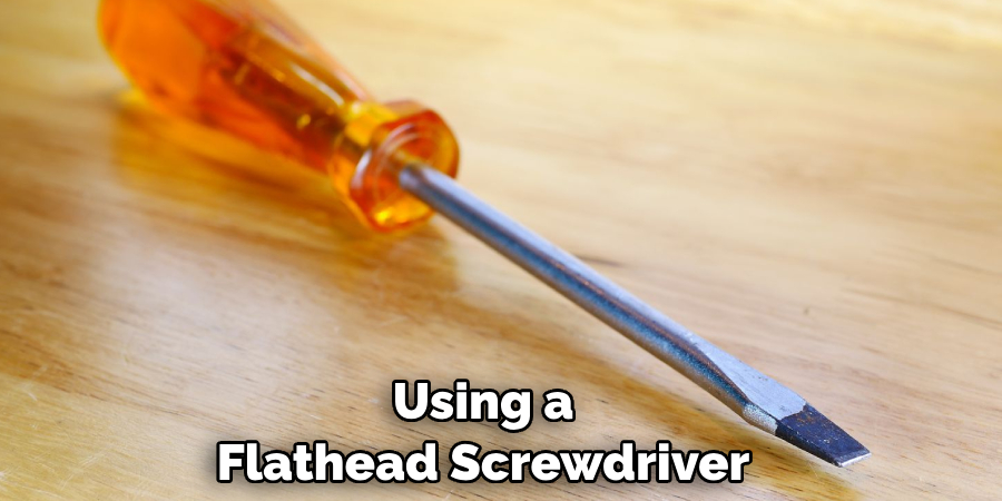 Using a Flathead Screwdriver