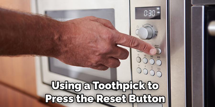 Using a Toothpick to Press the Reset Button