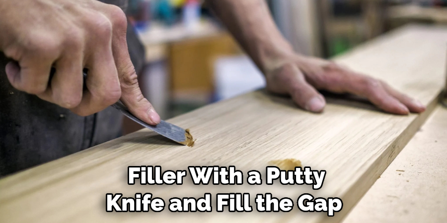  Filler With a Putty Knife and Fill the Gap