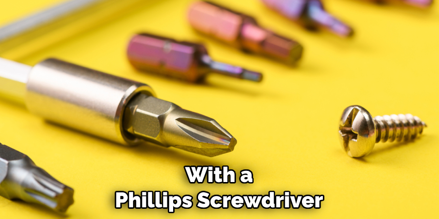 With a Phillips Screwdriver