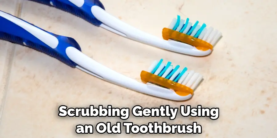 Scrubbing Gently Using an Old Toothbrush