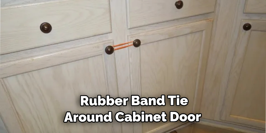  Rubber Band Tie Around the Cabinet Door 