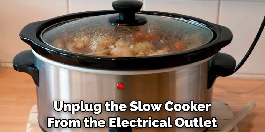 Unplug the Slow Cooker From the Electrical Outlet