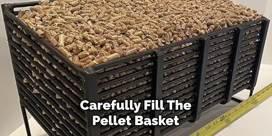 Carefully Fill the Pellet Basket 