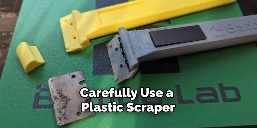 Carefully Use a Plastic Scraper