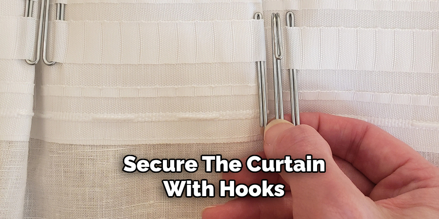 secure the curtain with hooks 