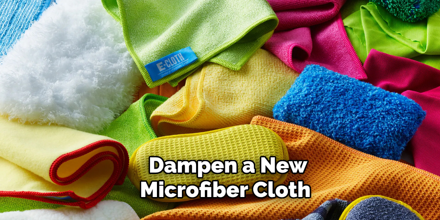 Dampen a new microfiber cloth