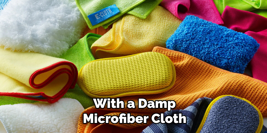 With a Damp Microfiber Cloth