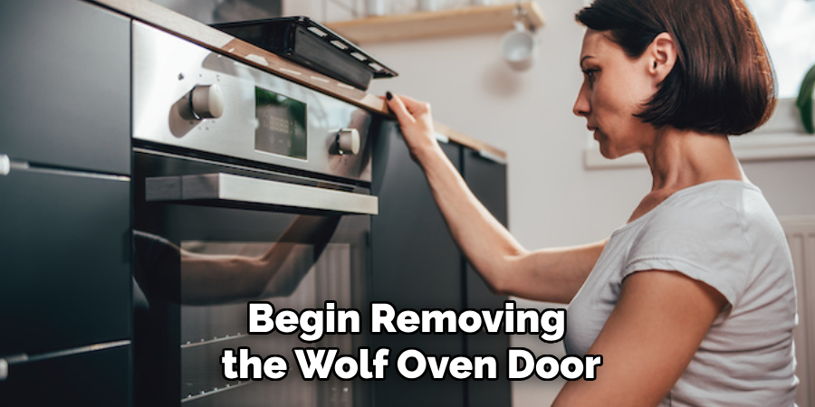 Begin Removing the Wolf Oven Door