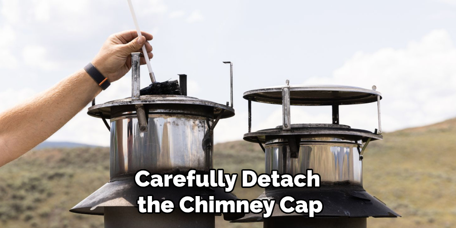 Carefully Detach the Chimney Cap