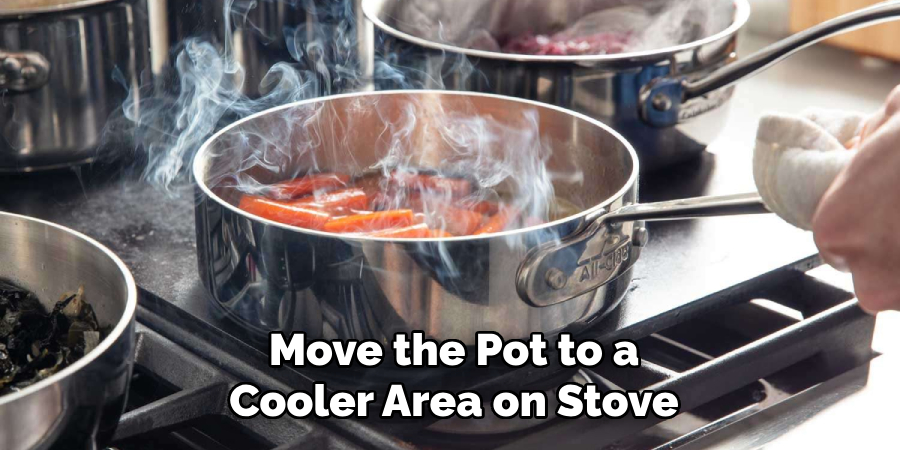 Move the Pot to a
Cooler Area on Stove