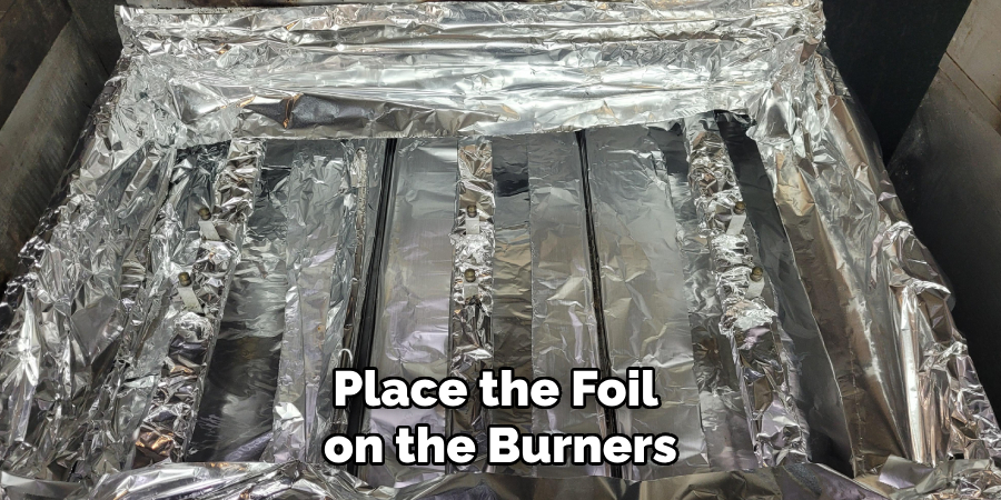 Place the Foil on the Burners