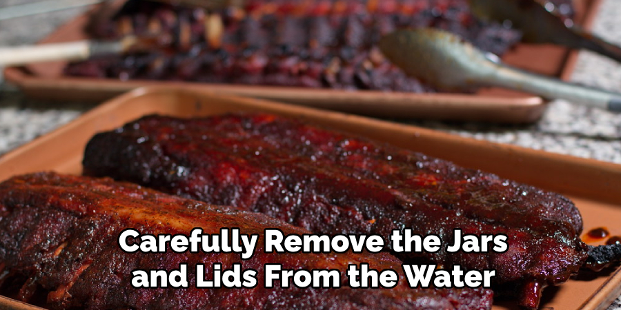 Carefully Remove the Jars and Lids From the Water