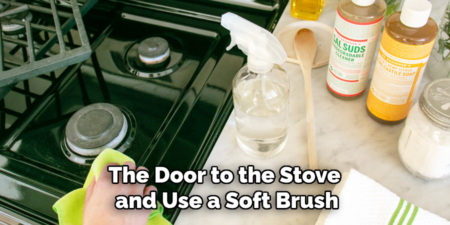 The Door to the Stove and Use a Soft Brush