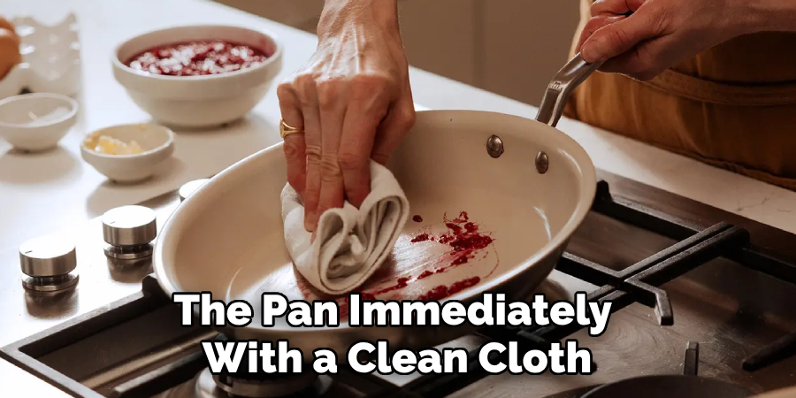 The Pan Immediately With a Clean Cloth