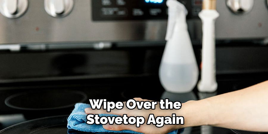 Wipe over the stovetop again