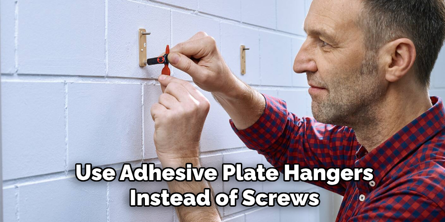 Use Adhesive Plate Hangers
Instead of Screws