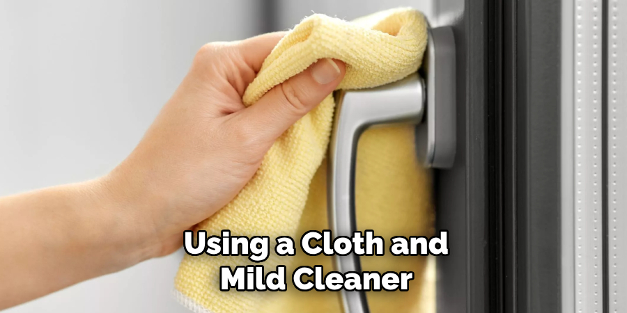 Using a Cloth and
Mild Cleaner