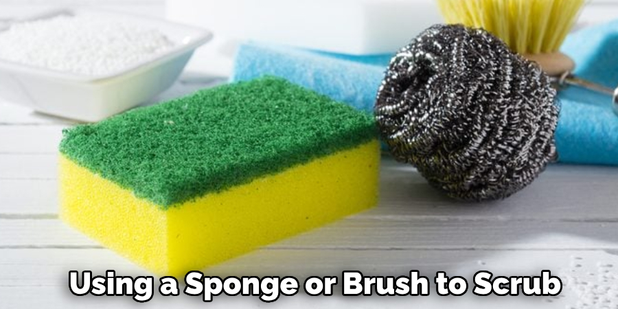 Using a Sponge or Brush to Scrub