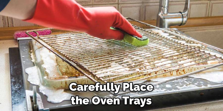 Carefully Place the Oven Trays
