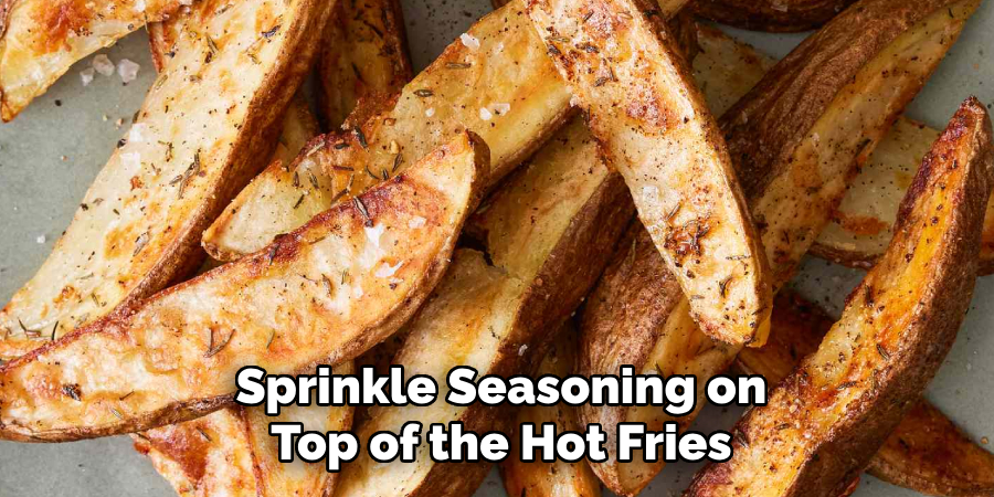Sprinkle Seasoning on Top of the Hot Fries