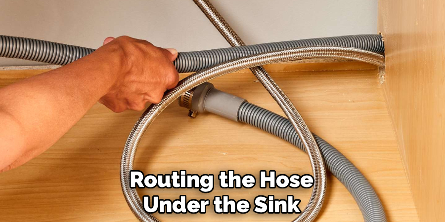 routing the hose under the sink