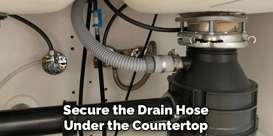 Secure the Drain Hose
Under the Countertop
